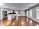 Expansive living room and kitchen area with stainless steel appliances, large windows and hardwood floors at 3122 Vandiver Dr, Marietta, GA 30066