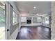 Cozy living room featuring brick walls, a fireplace, and hardwood floors at 3122 Vandiver Dr, Marietta, GA 30066