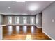Bright, open living area featuring hardwood floors, neutral paint, and large windows at 3122 Vandiver Dr, Marietta, GA 30066