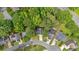 Aerial view of the home in a cul-de-sac with mature trees and well-maintained lawns at 3473 Whisperwood Nw Ct, Marietta, GA 30064