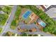 Aerial view of community amenities including a pool, tennis court, and playground at 3473 Whisperwood Nw Ct, Marietta, GA 30064