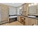 Bright bathroom featuring double sinks, granite counters, tub, and tiled shower at 3473 Whisperwood Nw Ct, Marietta, GA 30064