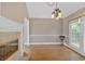 Bright dining room featuring hardwood floors, fireplace, and natural light at 3473 Whisperwood Nw Ct, Marietta, GA 30064