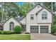 Charming traditional two-story home with a well-manicured lawn and an attached two-car garage at 3473 Whisperwood Nw Ct, Marietta, GA 30064