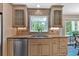 Well-lit kitchen boasts granite countertops, stainless steel appliances, and ample cabinet space at 3473 Whisperwood Nw Ct, Marietta, GA 30064