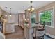 Spacious kitchen with a central island, granite counters, stainless appliances, and tile floors at 3473 Whisperwood Nw Ct, Marietta, GA 30064