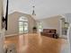 Spacious living room featuring large windows, vaulted ceiling, and hardwood floors at 3473 Whisperwood Nw Ct, Marietta, GA 30064