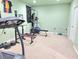 Basement exercise area with carpeted floors and assorted workout equipment at 827 Autry Oak Ct, Johns Creek, GA 30022