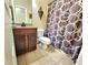 Bathroom featuring a vanity, toilet, shower, and decorative shower curtain at 827 Autry Oak Ct, Johns Creek, GA 30022