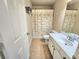Practical bathroom featuring tiled floor, a shower/tub combination, a toilet, and vanity at 827 Autry Oak Ct, Johns Creek, GA 30022