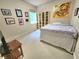 Bedroom with carpet, art, shelving, and a bed with decorative bedspread at 827 Autry Oak Ct, Johns Creek, GA 30022