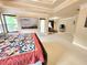 Large main bedroom with sitting area, tray ceiling, and bright natural light from multiple windows at 827 Autry Oak Ct, Johns Creek, GA 30022