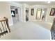 Upstairs hallway with multiple doors and hallway bathroom access at 827 Autry Oak Ct, Johns Creek, GA 30022