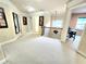 Upstairs hallway featuring neutral carpet, iron railings, and access to a study or office at 827 Autry Oak Ct, Johns Creek, GA 30022