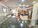 Bright kitchen with granite countertops, stainless steel appliances, and beautiful wood floors at 827 Autry Oak Ct, Johns Creek, GA 30022