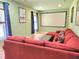 Cozy living room with a large sectional sofa and home theater projector screen at 827 Autry Oak Ct, Johns Creek, GA 30022