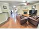 Open living room features hardwood floors, a fireplace, and plenty of seating at 827 Autry Oak Ct, Johns Creek, GA 30022