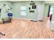 Spacious living room featuring wood laminate flooring and an open layout, great for gatherings and entertaining at 827 Autry Oak Ct, Johns Creek, GA 30022