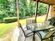 Back patio with an outdoor dining set offering a view of the lush green lawn at 827 Autry Oak Ct, Johns Creek, GA 30022