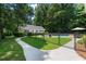 Backyard with a pool, a black metal fence and mature trees at 1824 Mount Paran Nw Rd, Atlanta, GA 30327