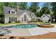 Beautiful backyard featuring a pool, hot tub, and outdoor seating, perfect for entertaining at 1824 Mount Paran Nw Rd, Atlanta, GA 30327