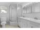 Clean bathroom with a double sink vanity, shower, and a bright window at 1824 Mount Paran Nw Rd, Atlanta, GA 30327