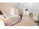 Bedroom with a view to the playroom, featuring built-in bookshelves and a small table and chairs at 1824 Mount Paran Nw Rd, Atlanta, GA 30327
