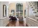 Open foyer leading to a living room featuring an arched window at 1824 Mount Paran Nw Rd, Atlanta, GA 30327