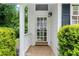 Charming home's front entrance with a classic door, stone walkway, and manicured greenery at 1824 Mount Paran Nw Rd, Atlanta, GA 30327