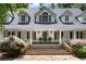 Charming two-story home featuring a welcoming front porch and stone staircase at 1824 Mount Paran Nw Rd, Atlanta, GA 30327