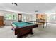 Well-lit game room with pool table, ping pong table, and kitchenette for entertaining at 1824 Mount Paran Nw Rd, Atlanta, GA 30327