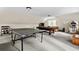 Large game room with ping pong table, pool table, juke box, and comfortable seating area at 1824 Mount Paran Nw Rd, Atlanta, GA 30327