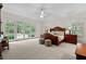 Serene main bedroom with French doors, plush carpet, and natural light at 1824 Mount Paran Nw Rd, Atlanta, GA 30327