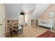 Playroom featuring built-in bookshelves, a small table and chairs, and a crib at 1824 Mount Paran Nw Rd, Atlanta, GA 30327