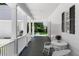 Covered porch with outdoor seating and a view of the lawn at 1824 Mount Paran Nw Rd, Atlanta, GA 30327