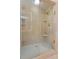 Bathroom featuring tile shower with glass doors and corner shelves at 1824 Mount Paran Nw Rd, Atlanta, GA 30327