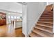 Carpeted staircase leading to a bright dining and kitchen area at 1824 Mount Paran Nw Rd, Atlanta, GA 30327