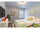 Charming bedroom with artwork and open shelving showcases a personalized space for relaxation at 3458 Carriage Chase Rd, Atlanta, GA 30349