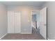Light-filled bedroom with closet leads to a well-lit hallway offering privacy and spaciousness at 3458 Carriage Chase Rd, Atlanta, GA 30349