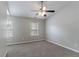 Large bedroom with dual windows and ceiling fan provides a comfortable and airy retreat at 3458 Carriage Chase Rd, Atlanta, GA 30349