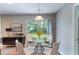View of the dining area with an elegant glass table and sliding glass doors to the yard at 3458 Carriage Chase Rd, Atlanta, GA 30349