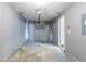 An empty garage with a gray door and concrete floors ready for parking and storage at 3458 Carriage Chase Rd, Atlanta, GA 30349