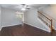 View of the living room with hardwood floors and a staircase with wood trim at 3458 Carriage Chase Rd, Atlanta, GA 30349