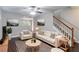 Beautifully furnished living room with modern decor, hardwood floors, and neutral paint at 3458 Carriage Chase Rd, Atlanta, GA 30349
