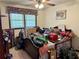 This bedroom features a ceiling fan and window but is currently cluttered at 115 Cannongate Cir, Sharpsburg, GA 30277
