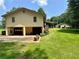 Home exterior and garage showing curb appeal with nice back yard at 115 Cannongate Cir, Sharpsburg, GA 30277