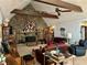 Spacious living room with a unique stone fireplace, vaulted ceiling, and comfortable seating at 115 Cannongate Cir, Sharpsburg, GA 30277