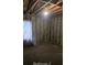 Renovation-needed bedroom with cinder block walls and hardwood flooring at 133 Buchanan Ln, Atlanta, GA 30315