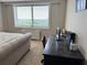 Bright bedroom featuring a desk area and comfortable bed, with a sunny view from a window at 2479 Peachtree Ne Rd # 1714, Atlanta, GA 30305
