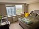 Bedroom featuring a large window with city views and a comfortable bed at 2479 Peachtree Ne Rd # 1714, Atlanta, GA 30305